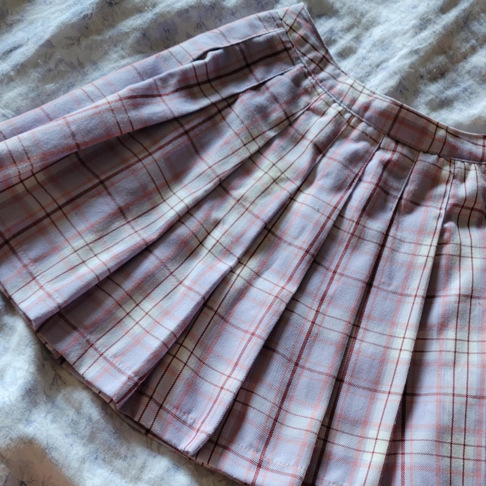 Small pleated pink and purple mini skirt